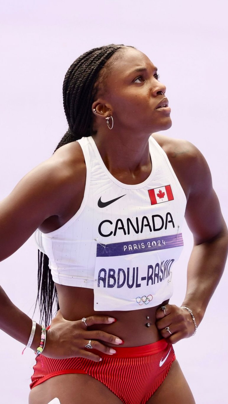 Mariam Abdul-Rashid coaching athletes on the track